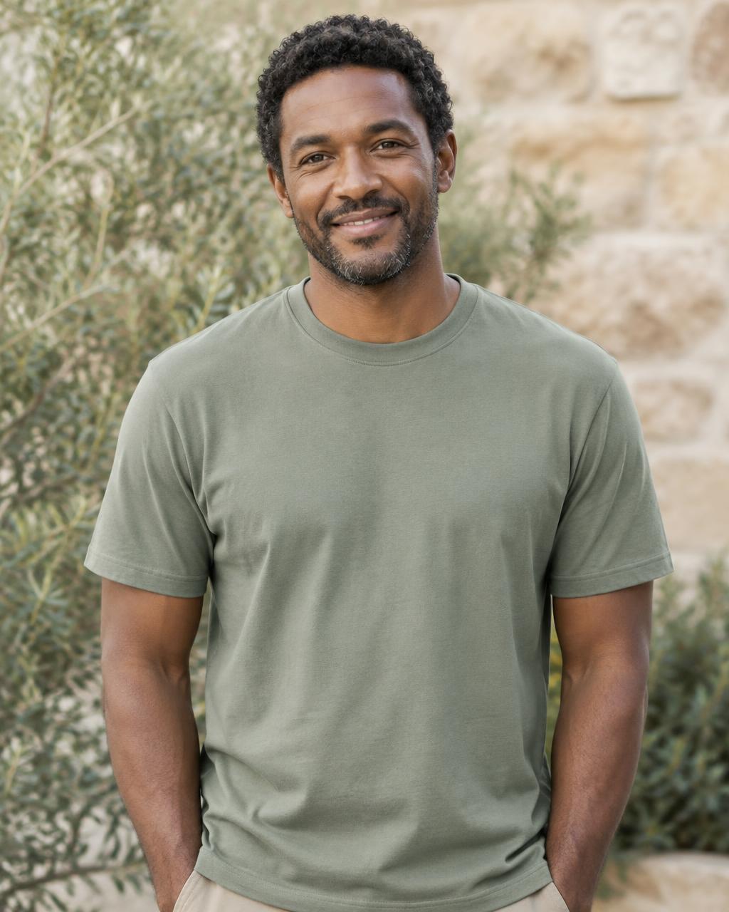 AI-generated adult Black male model wearing a plain sage shirt with no lettering